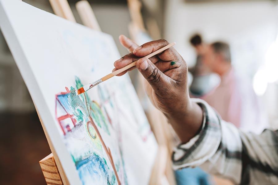 Art classes in Eureka Springs with visitors painting in a creative studio setting